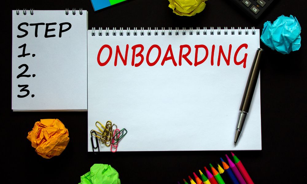 Customer onboarding steps written on note pad