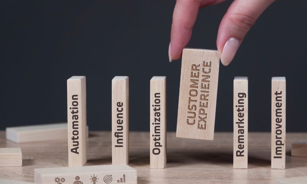 Block with customer experience written on it placed in between other blocks with marketing terminology on them.