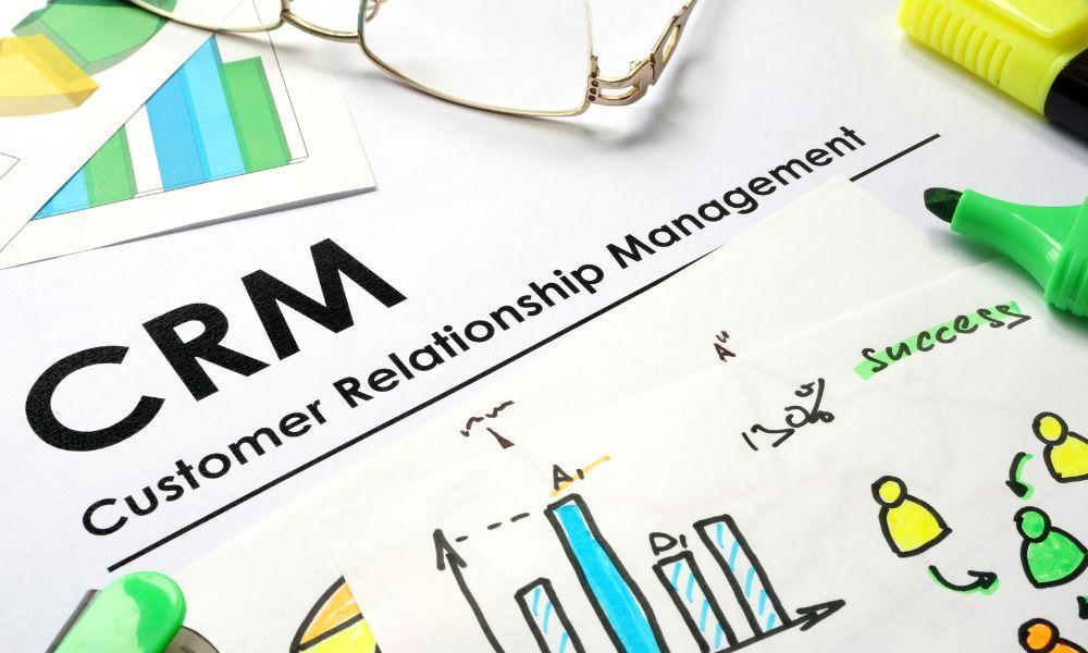 Paper with words CRM customer relationship management.