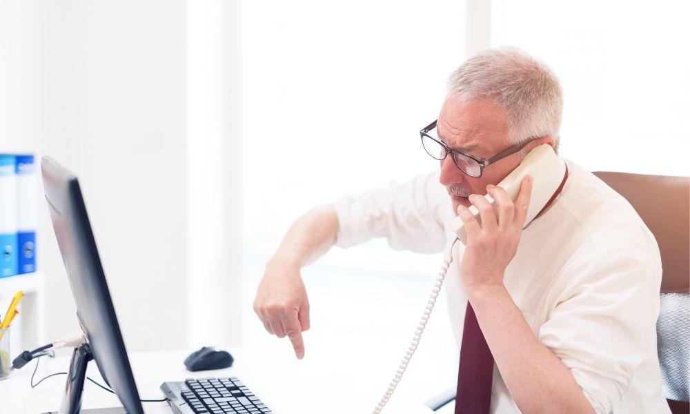 Angry customer talking on the phone.