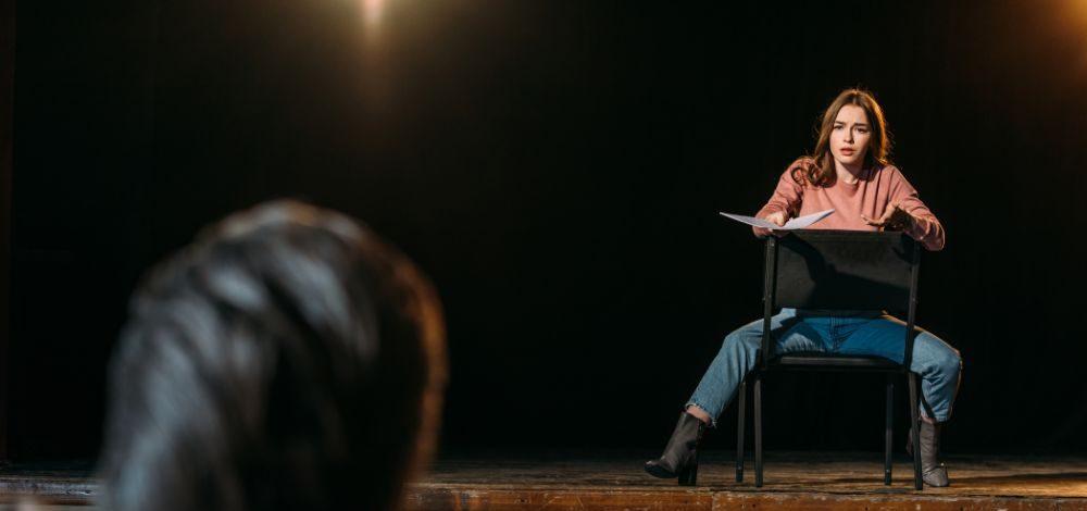 A casting director viewing an audition by a female actor.
