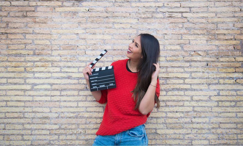 Woman with clipboard auditioning for an acting role.