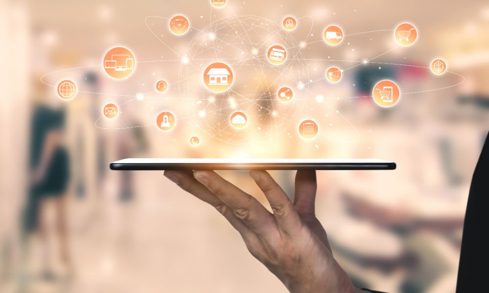 Man holding cellphone with icons depicting the various channels that customers interact with.