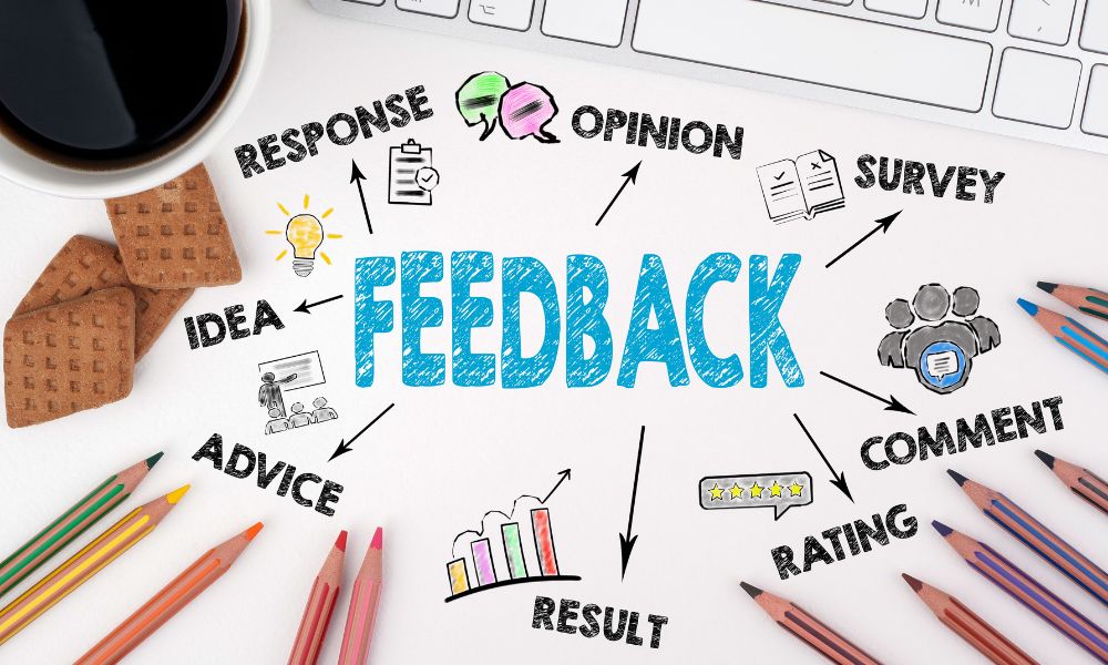 Customer feedback concept with coloured pencils, cup of coffee and keyboard.