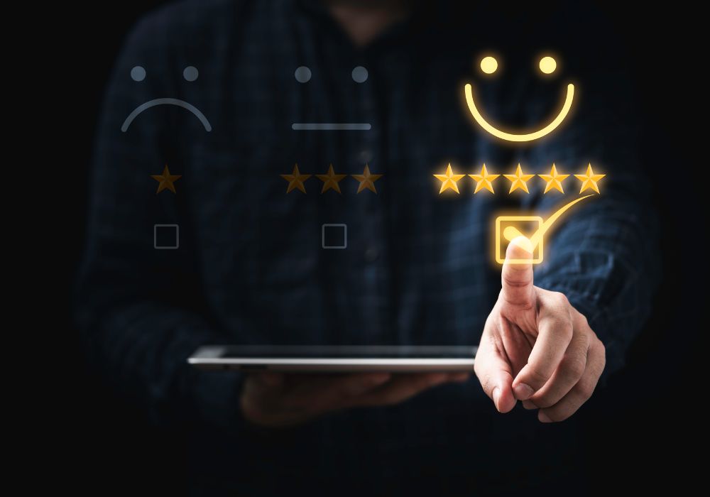 Customer holding a tablet and selecting the happy face with 5 stars icon.