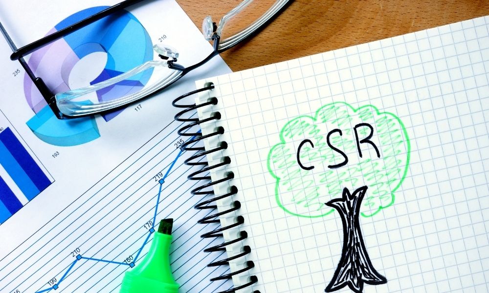 Notepad with a drawing of a tree and the words CSR.