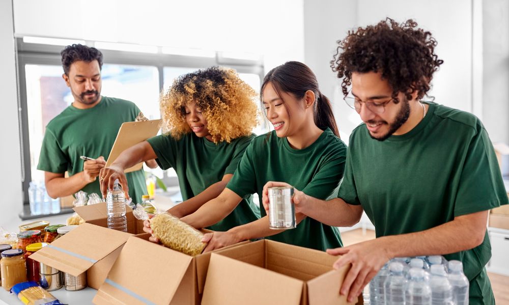 Employees packing donation boxes as part of their company’s corporate social responsibility activities.