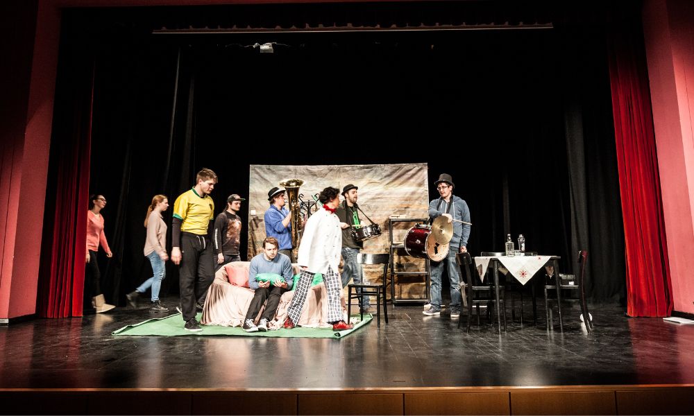 Actors on stage in a fringe theatre play.