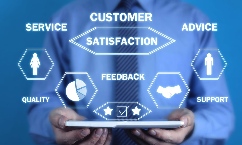 Man holding tablet with graphics and words representing factors in reducing customer retention.